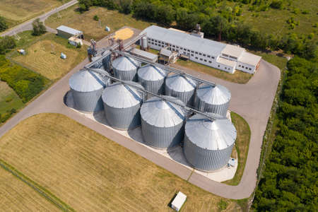 Aerial view of agricultural silos, grain elevator for storage and drying of cerealsの写真素材