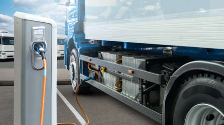 Electric truck batteries are charged from the charging stationの写真素材