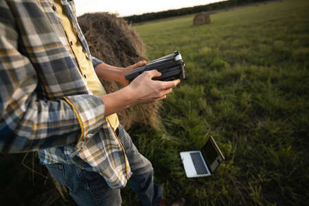 Farmer with drone on a field