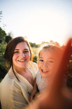 European mother and her Asian daughterの写真素材