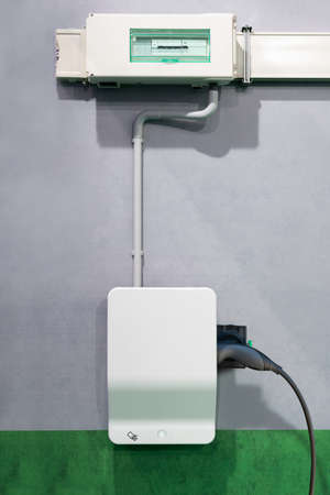 Charging station for electric vehicles on a wall