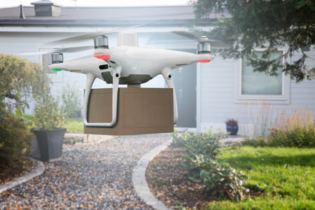 Drone with a package. Unmanned delivery conceptの写真素材