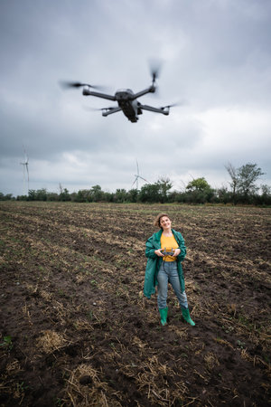Farmer with drone on a field. Smart farming and precision agricultureの写真素材