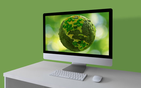 Computer with green planet Earth on a screenの写真素材