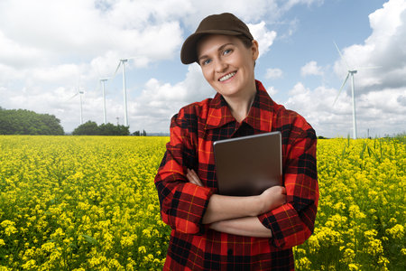 Farmer with digital tablet on an agricultural field. Smart farming and digital agriculture