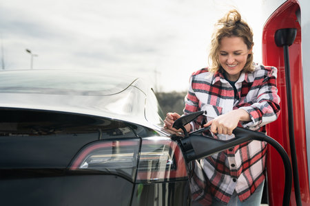 Woman charging an electric car