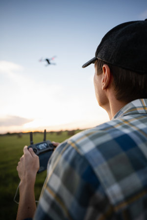 Farmer controls drone. Smart farming and precision agriculture. High quality photo