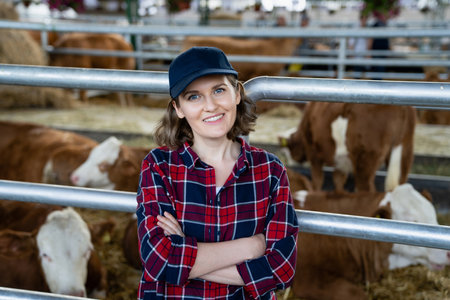 Woman farmer at a dairy farm. High quality photoの写真素材