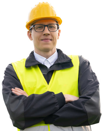 Portrait of a smiling engineer in a glasses, helmet and blue suit looking at camera. Isolated..
