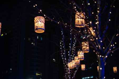 Blurred holiday background with bokeh. Defocused New Year and Christmas illumination.