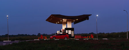 Modern self service gas station at night.