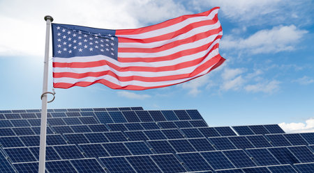 American flag flutters on the backgorund of solar panels. Symbol of sustainable development United States of America.の写真素材