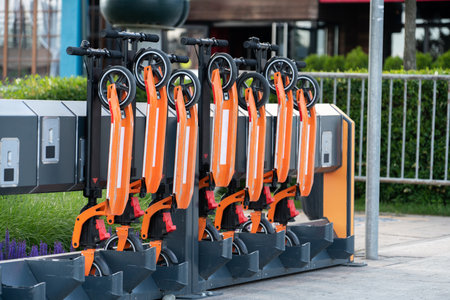 Push scooter rental station on a city street.