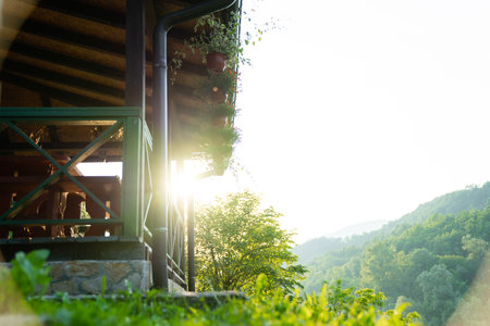 Porch of a wooden house in the forest on the river bank.の写真素材