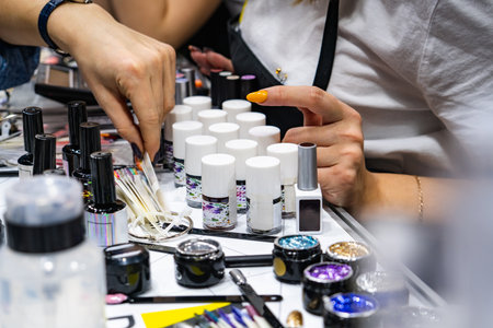 Woman chooses nail polish in a cosmetics store.の写真素材