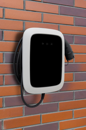Charging station for electric vehicles mounted on a wall.