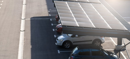 Parking space with solar panels on a roof.の写真素材