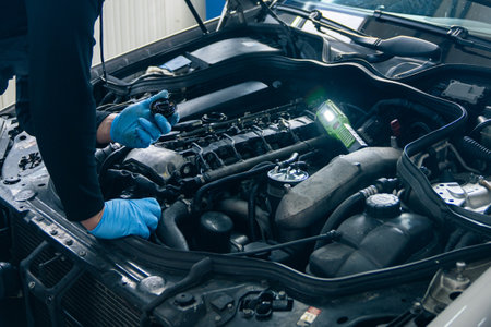 Serviceman repair car in car service.の写真素材
