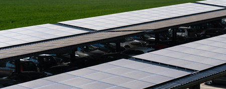 Solar canopy. Parking space with solar panels on a roof.
