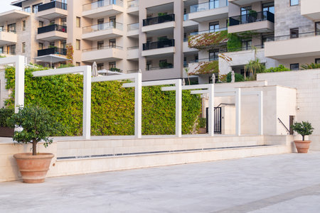 Vertical garden on a green wall. Environmentally friendly urban space..の写真素材