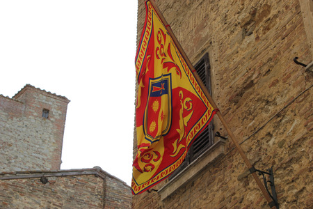 flag in the wind, exposed for a festival, in the colors of yellow and orangeの写真素材