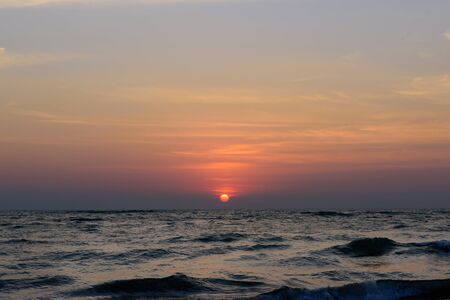 ocean sunset in a cloudy sky during vocation and relaxing