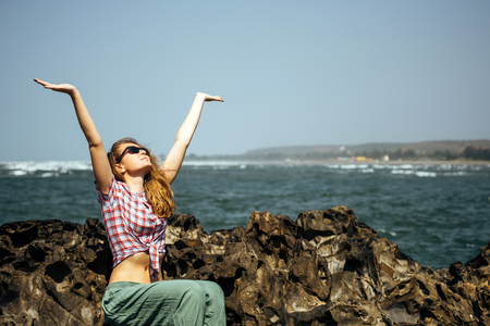 Young sexy girl relaxed near sea at summer holiday nice hot day,casual wear,enjoy,happy woman,relaxing,traveling,attractive,style,modelの写真素材