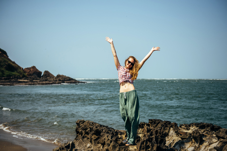 Young sexy girl relaxed near sea at summer holiday nice hot day,casual wear,enjoy,happy woman,relaxing,traveling,attractive,style,modelの写真素材
