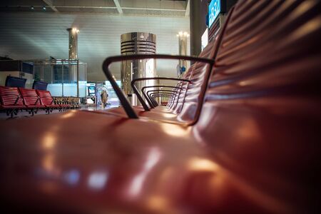 Rows of seats at the airport, close-up. Seats in the waiting room at the station, selective focus. Modern airport, futuristic design.の写真素材