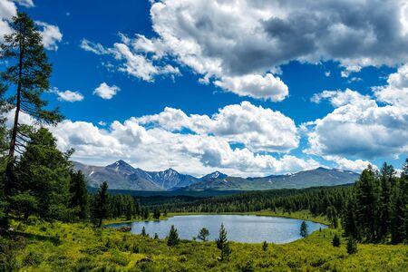 Beautiful lake in the Altai mountains, Siberia, Russia. Wild mountain lake on the background of snowy peaks. Summer landscape in the mountains.の写真素材