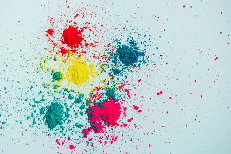 Abstract multicolor powder mixed on white background. Freeze motion of color powder. Concept Indian festival Holi.の写真素材