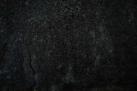 Black stone background. Cement, concrete grunge. Background blank for design. Dark gray wall texture.の写真素材