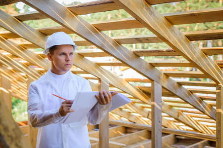 Young male engineer looking at construction work.の写真素材