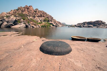 Tungabhadra river and coracle at hampi karnataka indiaの写真素材