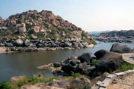 ruined landscape and tungabhadra river at hampi karnataka india.の写真素材