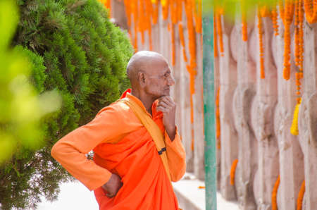 bodh gaya bihar april 30th 2018: an old lama attending special prayer during buddha purnima festival at bodh gaya bihar india.のeditorial素材