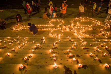 19th november 2021 varanasi uttar pradesh india :Ghats of Varanasi decorated and light up with small earthen lamps during Dev Diwali Festival at the ghats of Ganges in Varanasi. Dev Diwali is a festivのeditorial素材