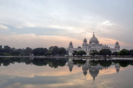 The Victoria Memorial is one of the most popular tourist destinations in Kolkata. Reflection is seen in the pond water in the garden area inside the Victoria Memorial.のeditorial素材