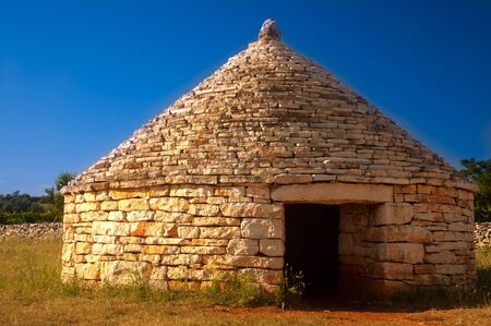 Traditional istrian hut - Kazun,  with blue sky in background.の写真素材
