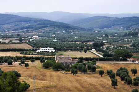 The view of the Toscana landscape with old and new villa on a hazy day.の写真素材