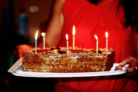 Delicious birthday cake with candles from Mom