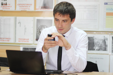 the manager in office working at a laptopの写真素材