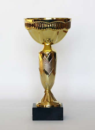 The golden trophy isolated on white backgroundの写真素材