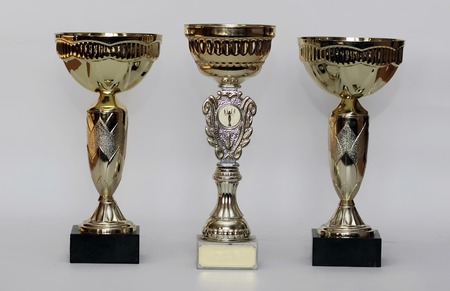 three different kind of golden trophies. Isolated on white backgroundの写真素材
