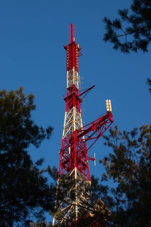 Telecommunications tower in a day of clear blue sky.の写真素材