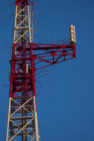 Telecommunications tower in a day of clear blue sky.の写真素材
