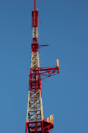 Telecommunications tower in a day of clear blue sky.の写真素材