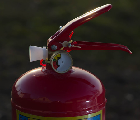 RED fire extinguisher close up. dry chemicalの写真素材