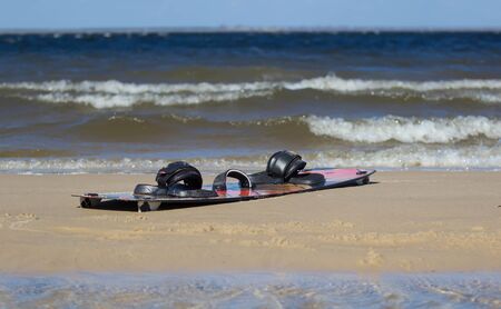 Kitesurfing board on the beach in Ukraine. Close-up