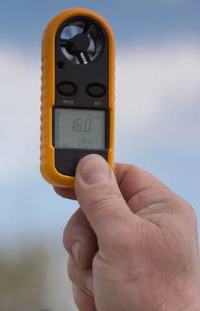 Anemometer in the hand of man, which measures wind speedの写真素材